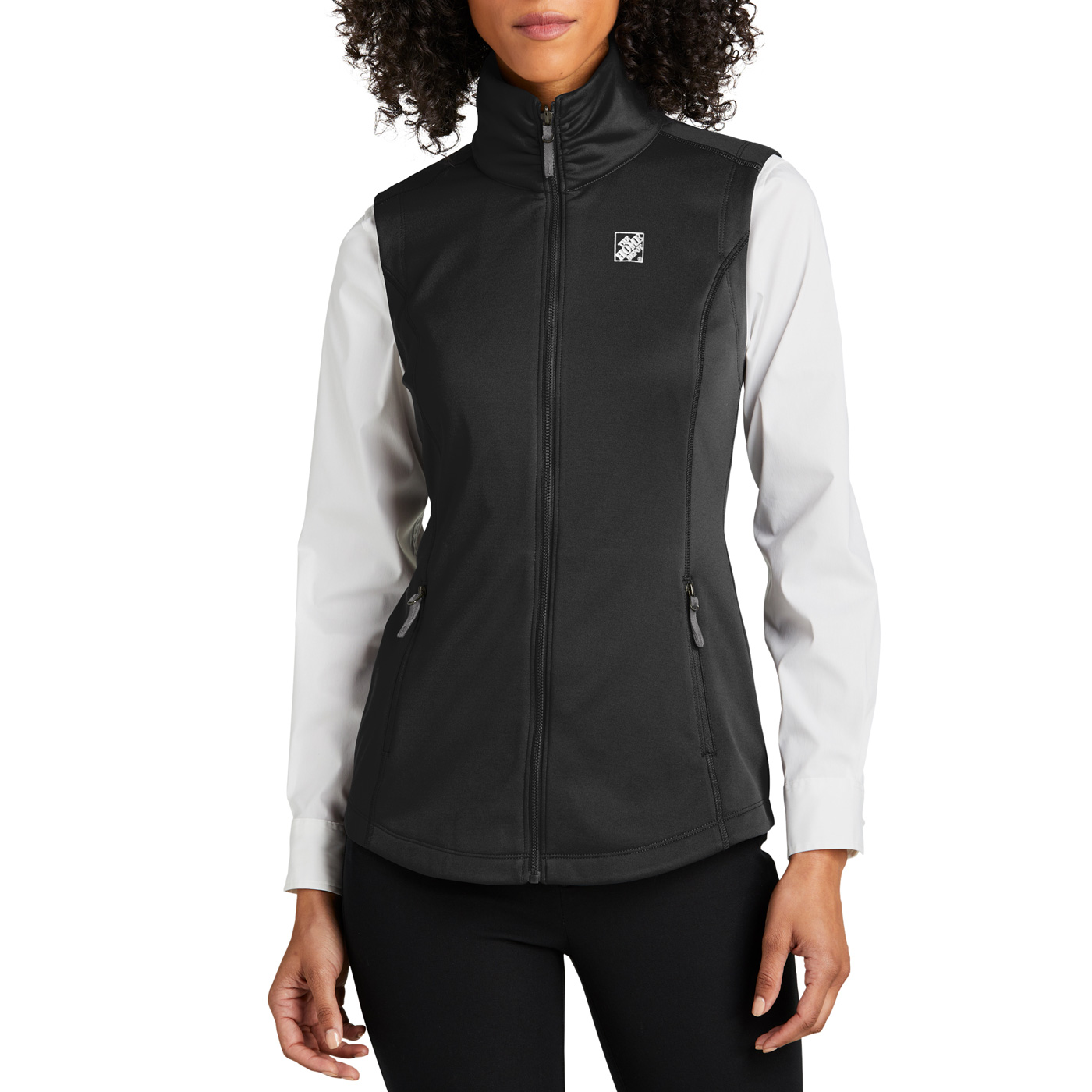 black fleece vest with white The Home Depot logo, worn by a female model