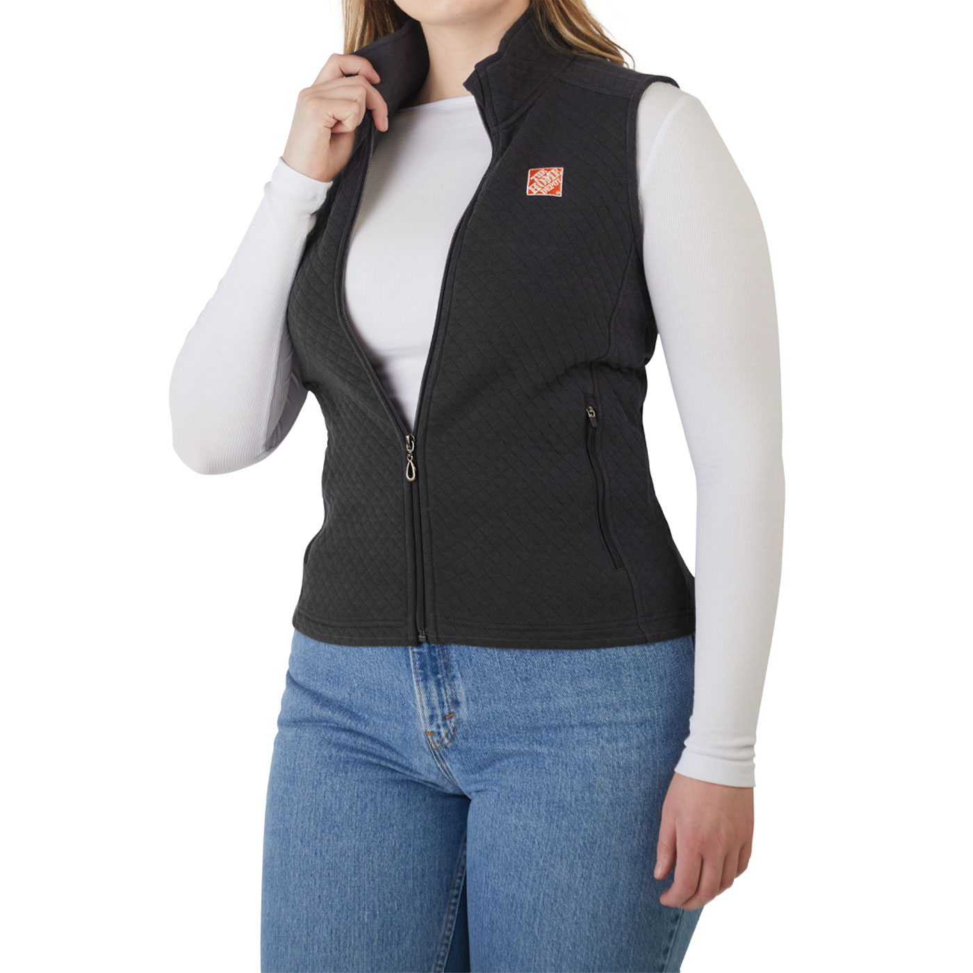 black textured vest with orange The Home Depot logo worn by a female model